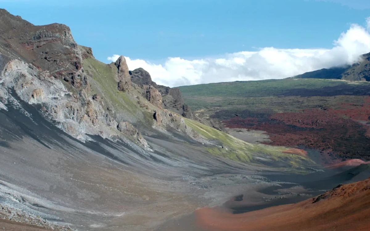 Hikers walking a cinder trail on the floor of the Haleakala crater