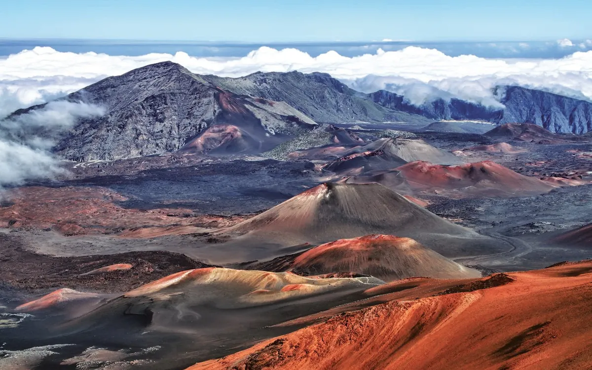 The wide summit valley of Haleakalā with red cinder cones standing on its floor