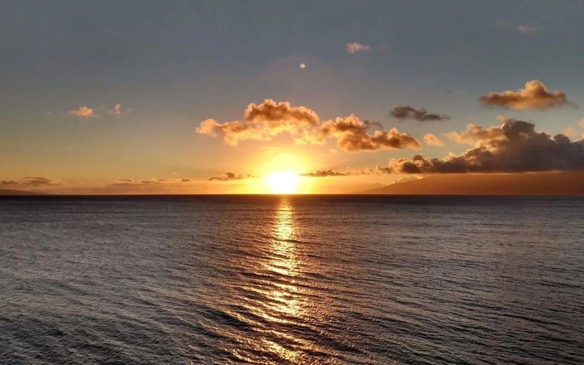 The sun going down over the ocean, seen from high on the mountain